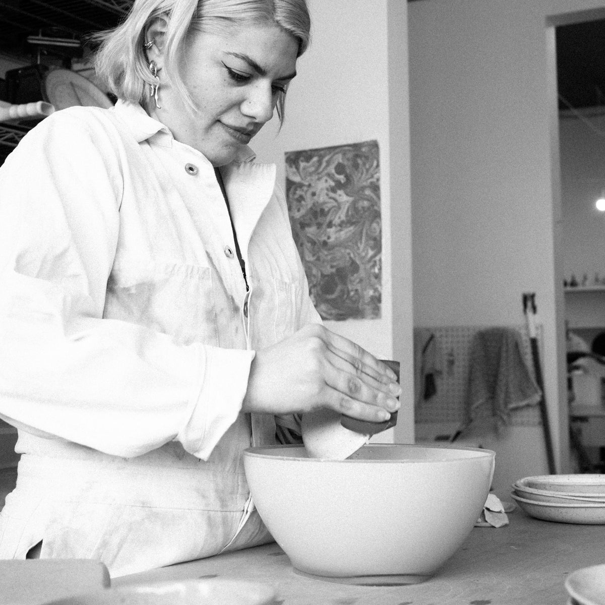 Lola Cera (Camille Zurini) sanding a Pamie bowl as the finishing touch.