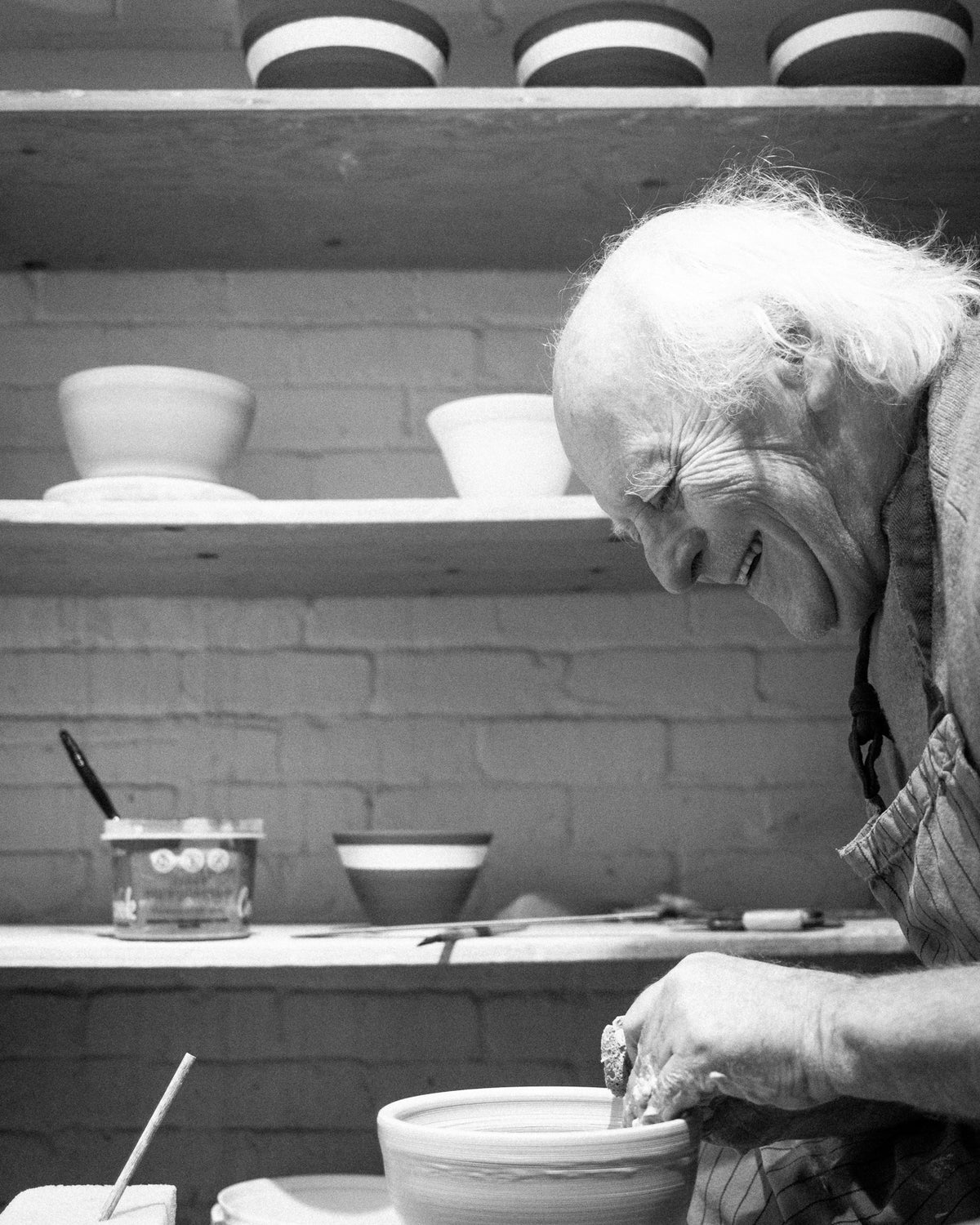 Jacques Benoit making a pot on his pottery wheel.