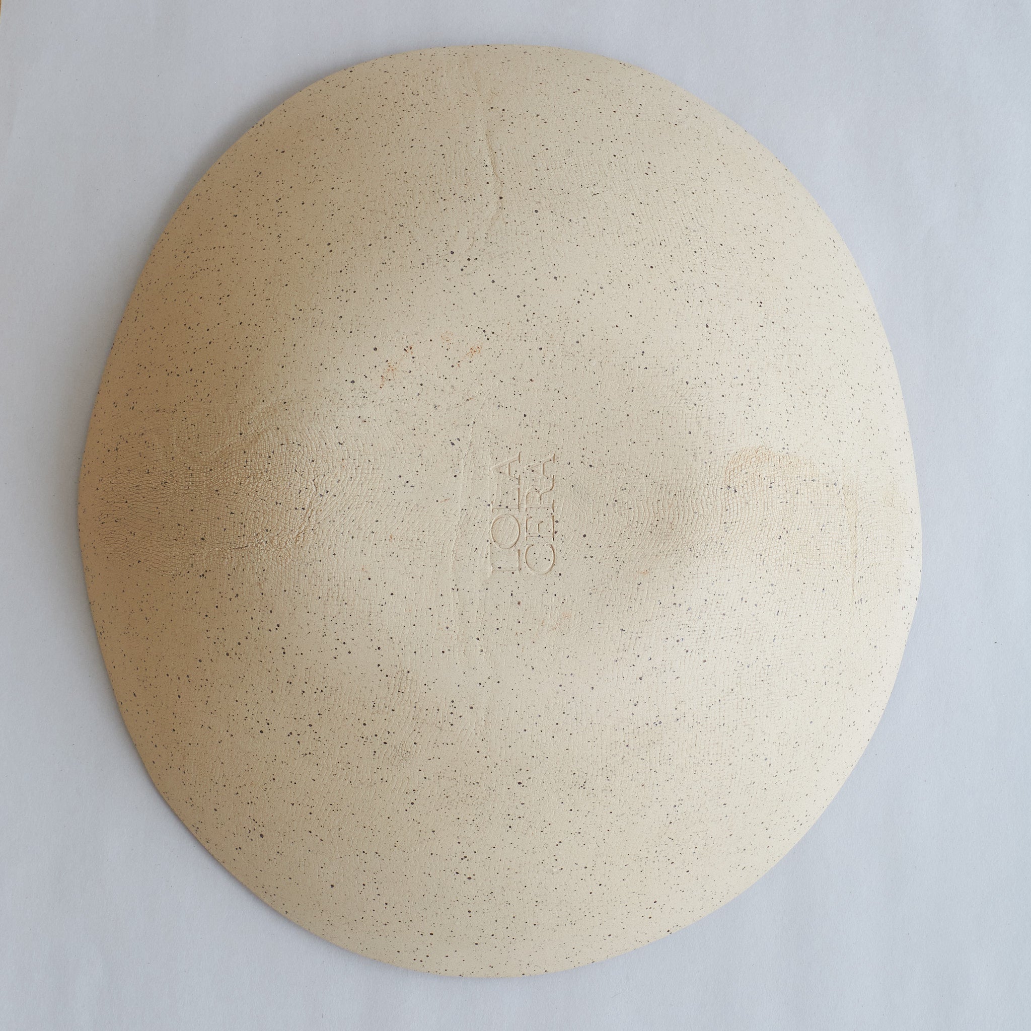 Bottom view of fruit bowl made of speckled stoneware