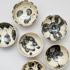 Black and white earthenware bowls by Marie Serreau