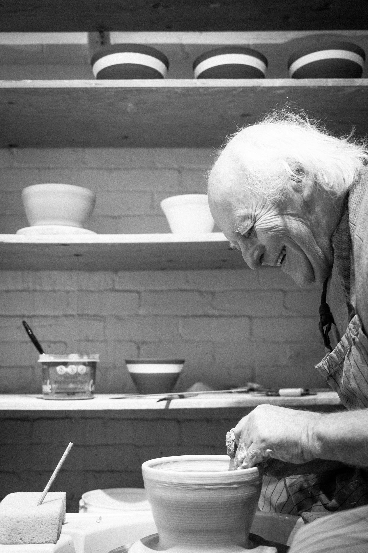 Jacques Benoit making a pot on his pottery wheel.