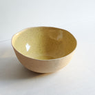 Large yellow bowl made of speckled stoneware 