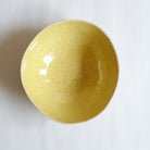 Large yellow bowl made of speckled stoneware 