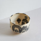 Black and white earthenware bowl by Marie Serreau