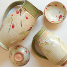 Ceramic pitchers with winter camellia and cherry blossom designs