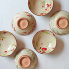 Set of ceramic bowls with floral patterns on a white background 