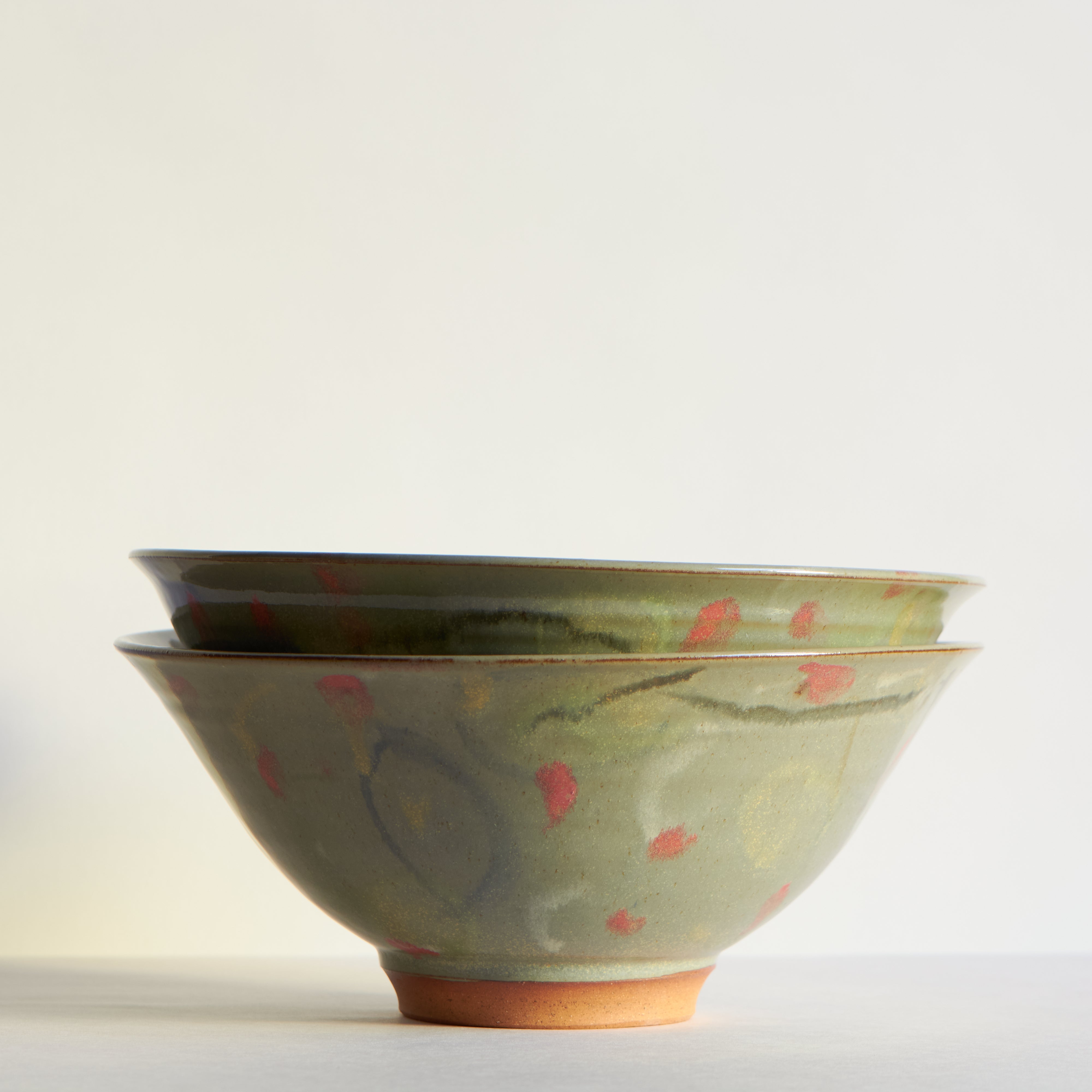 Two ceramic bowls with floral patterns on a light background