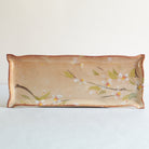 Rectangular ceramic dish with cherry blossom design on a white background