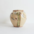 Back  of ceramic teapot with morning glories design on a light background