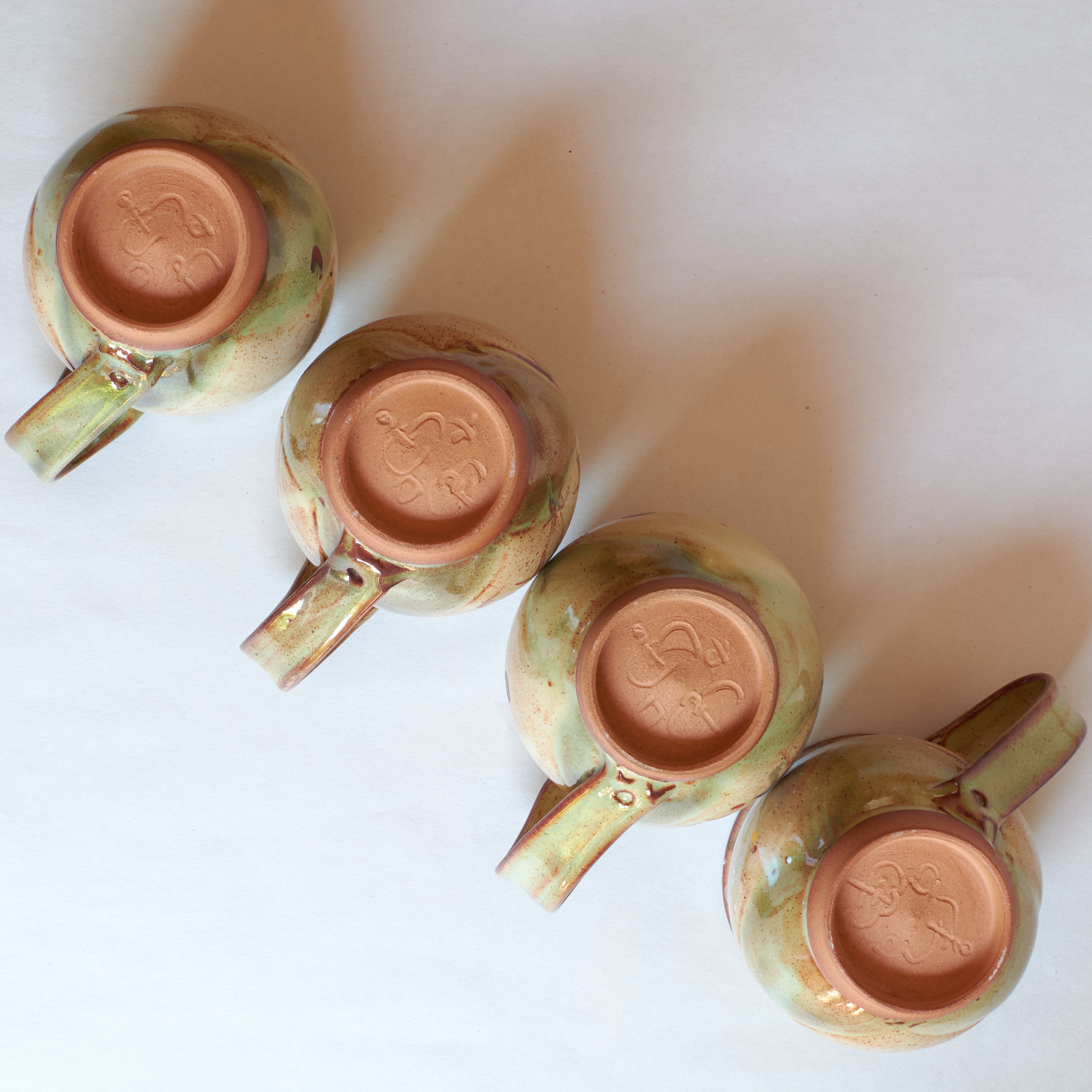 Bottom of Four Mugs Representing four seasons