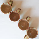 Inside of Four Mugs Representing four seasons